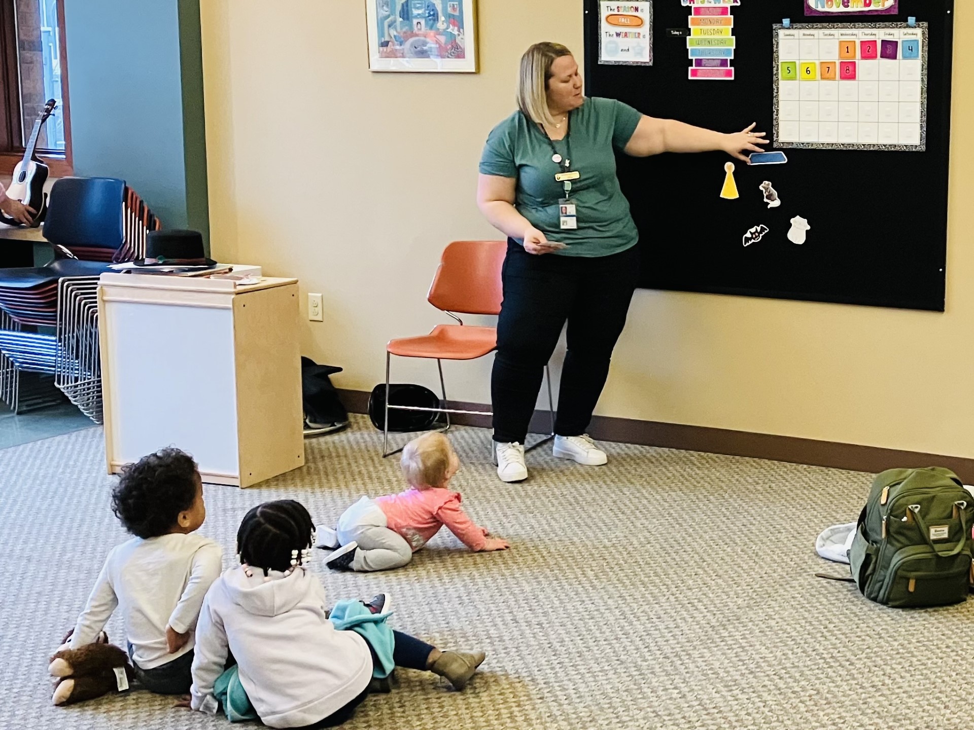 Librarian doing a flannel story with children watching