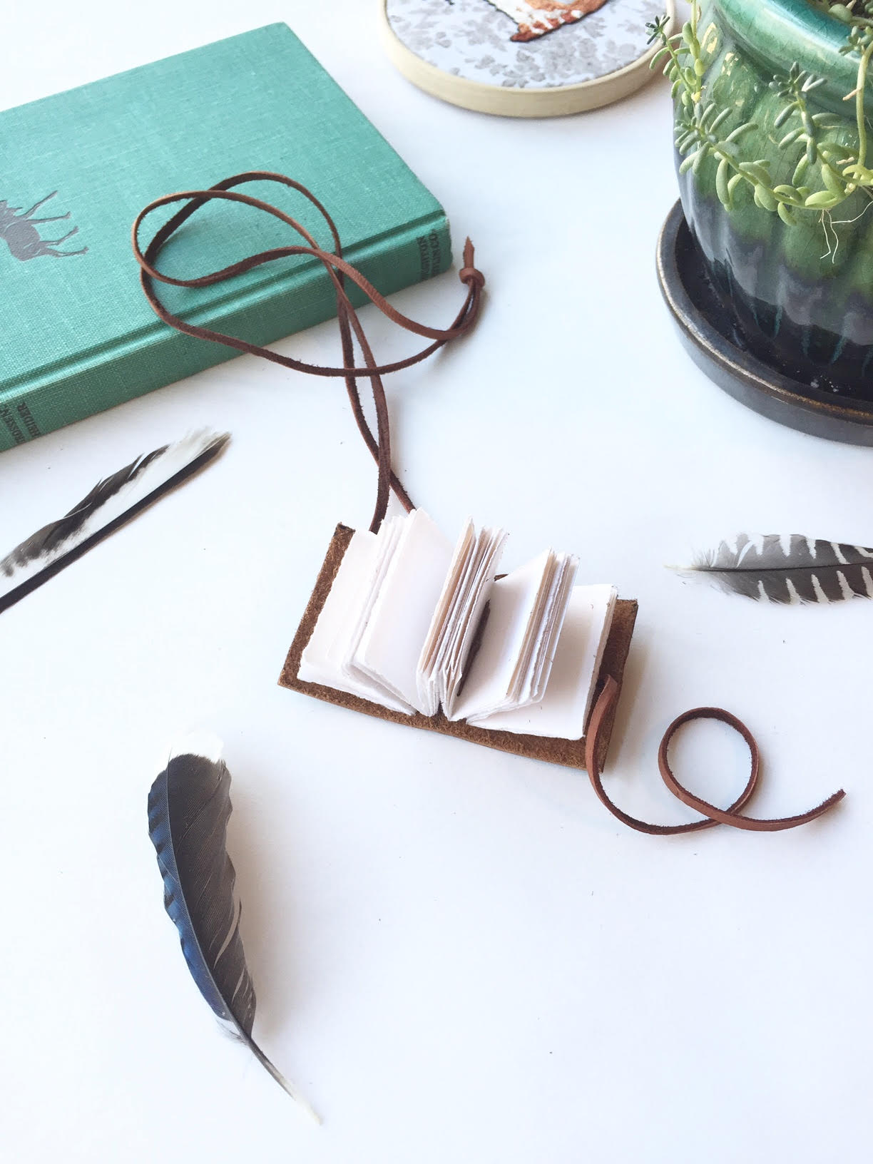 Leather necklace with book charm