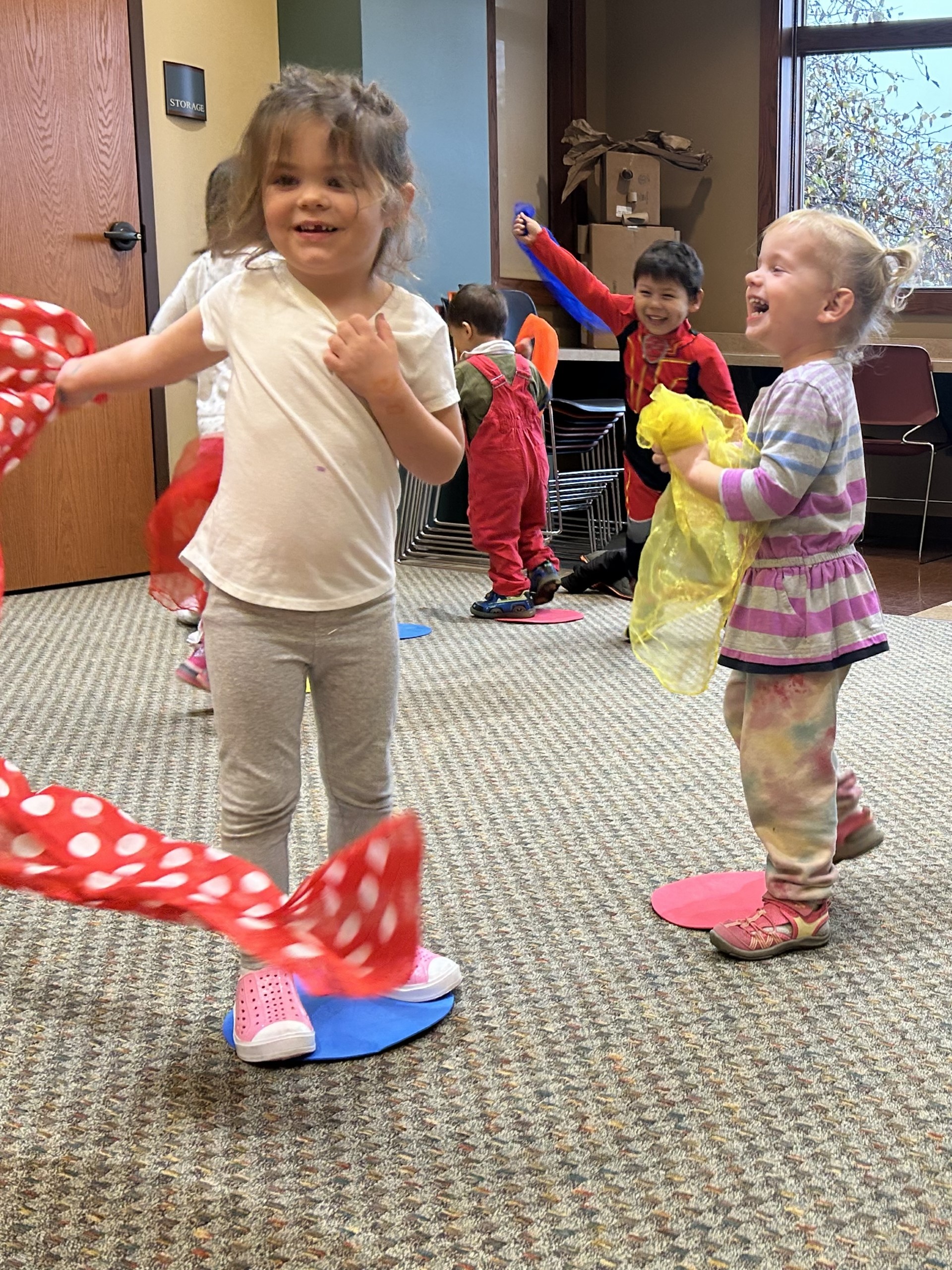 Children dancing with scarves