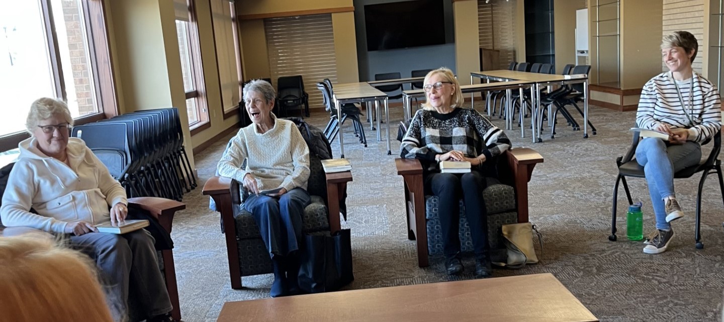 4 people enjoying book club