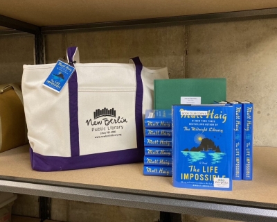 Book club kit with tote bag, books, and discussion question folder
