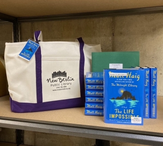 Book club kit with tote bag, books, and discussion question folder