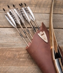 Leather quiver holding 6 arrows and a partial view of a bow