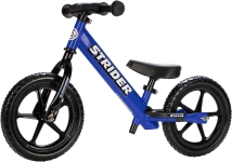 a blue balance bike with fat tires and no pedals