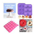 Cake cookbook, cupcake molds and photograph of cake pan, cake and berries