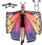 The back of a woman wearing butterfly wings as a costume. The wings are whie, black and shades of orange, purple and pink. She is wearing a headband with antenna.