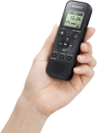 Hand holding digital voice recorder