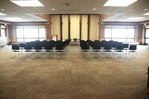 Large Community Room, arranged with chairs in rows with central aisle