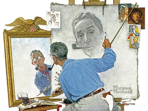American artist Norman Rockwell painting his own portrait in the mirror