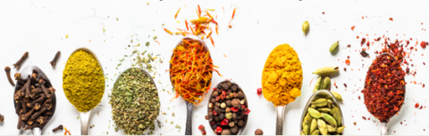 spoons with colorful spices