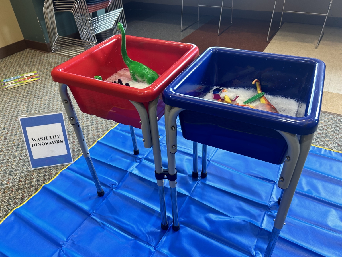 Wash the dinosaurs sensory bin