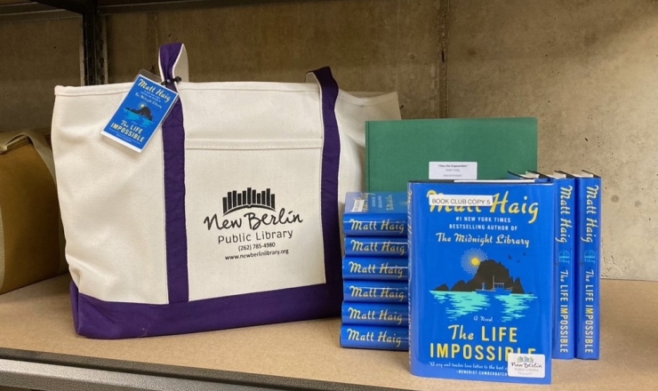 Book club kit with tote bag, books, and discussion question folder
